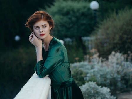 woman in green dress in the garden walk lifestyle summerの写真素材