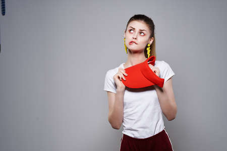 cheerful pretty woman in red cap fashion earrings jewelry summer styleの写真素材