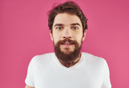 bearded man in a white t-shirt hand gestures Lifestyleの写真素材