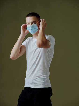 guy wearing a medical mask white t-shirt vaccine passport infection