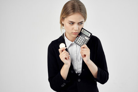 Businesswoman Bitcoin cryptocurrency in hands light backgroundの写真素材