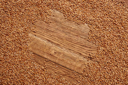 sprinkled cereals on a wooden table top view kitchen healthy foodの写真素材