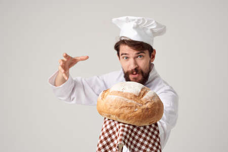 male cook with bread in hand culinary industryの写真素材