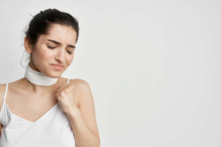 woman with closed eyes and holding her head depression emotionsの写真素材