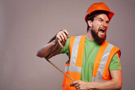 male builder orange helmet on the head Professionalの写真素材