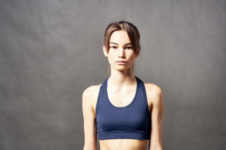 cute athletic brunette with a towel on her shoulder slim figureの写真素材