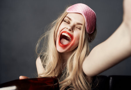 drunk woman smeared lipstick night life alcohol bottle close-up