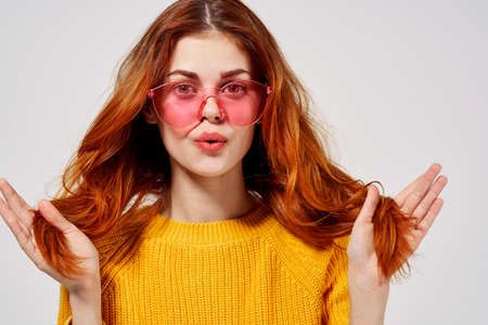 pretty woman in fashionable glasses hairstyle fashion glasses isolated background