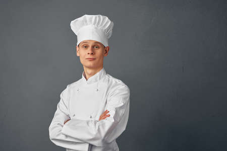 male chef professionals restaurant kitchen cooking dark backgroundの写真素材