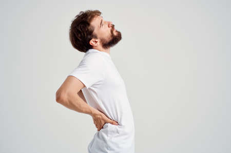 emotional man back pain health problems massage therapy isolated backgroundの写真素材