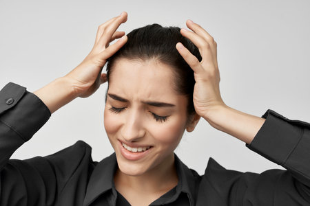 brunette headache discontent trouble isolated backgroundの写真素材