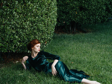 woman in green dress beauty green grass summer is a fairy gardenの写真素材