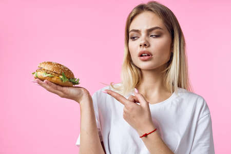 woman in white t-shirt hamburger snack delicious food restaurant