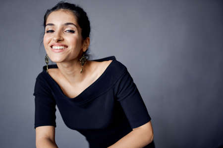 pretty woman posing model attractive look decoration smile dark backgroundの写真素材