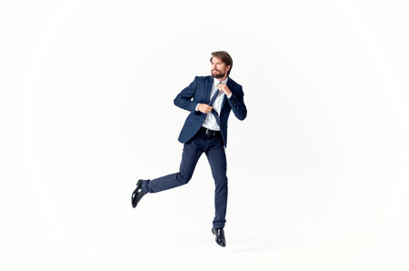 man in a suit emotions successful light backgroundの写真素材