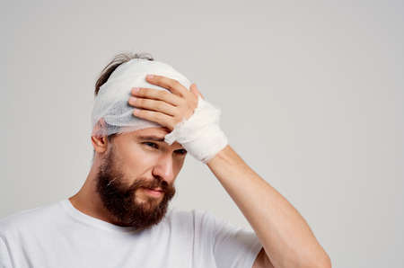 Man in a white t-shirt trauma health diagnosis treatmentの写真素材