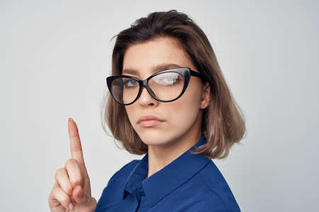 elegant woman wearing glasses blue shirt studio