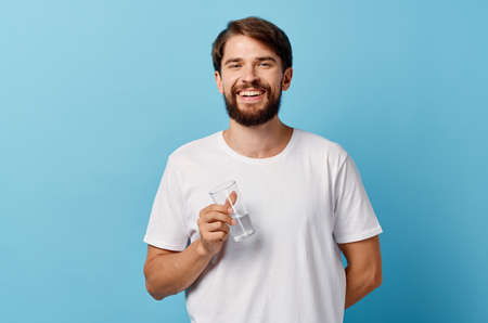 bearded man drinking water isolated backgroundの写真素材