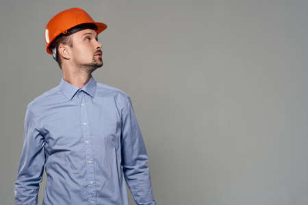 Man orange helmet engineer safety isolated background