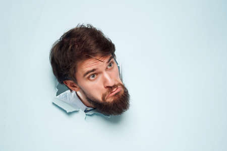 emotional man peeking out of the background Job businessの写真素材