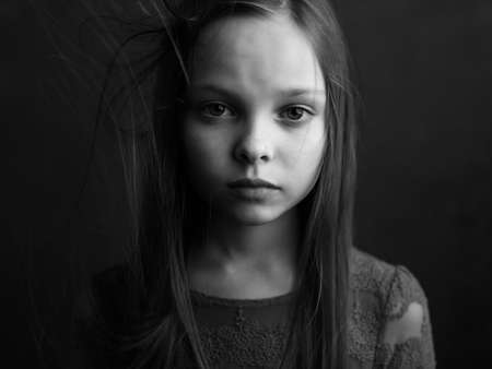 little girl posing long hair close-up black and white photoの写真素材