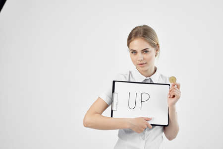 Businesswoman in a white shirt with a folder in hand isolated backgroundの写真素材