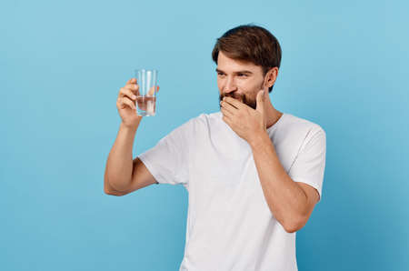 bearded man drinking water isolated backgroundの写真素材
