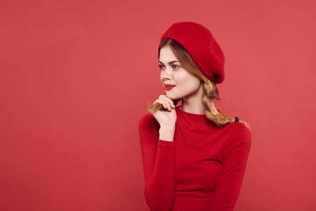 pretty woman in a red sweater cosmetics emotion isolated backgroundの写真素材