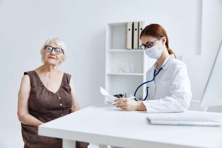 doctors in the medical office patient examination professional treatmentの写真素材
