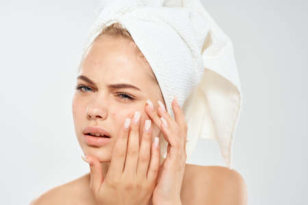 woman with towel on head skin care dermatology dissatisfaction problemの写真素材
