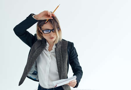 Business woman wearing glasses documents notepad officeの写真素材