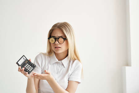 cheerful woman in a white shirt with a folder in hand isolated backgroundの写真素材