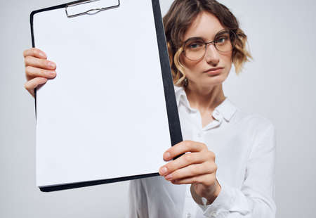 business woman holding in hand folder blank sheet copy space officeの写真素材