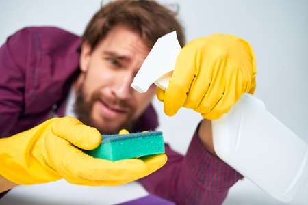 man with detergent washing accessories routine workの写真素材