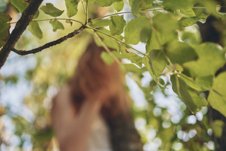 cheerful pretty woman green tree forest recreationの写真素材