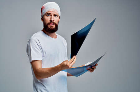 a patient X-rays in hands health diagnostics light background