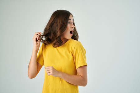 surprised woman holding face but emotions upsetの写真素材