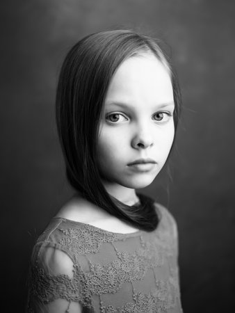 portrait of a little girl close-up posing black and white photoの写真素材