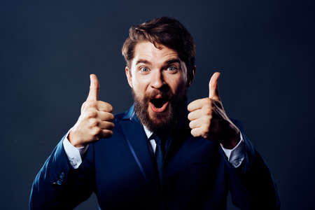 The man in a suit emotions hand gestures isolated backgroundの写真素材