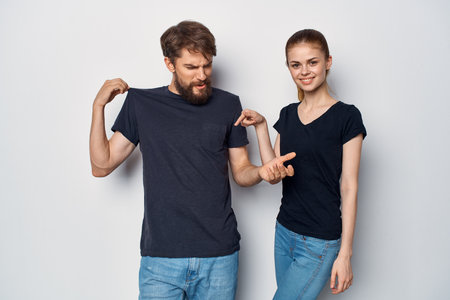 a young couple in black t-shirt sunglasses posing isolated backgroundの写真素材