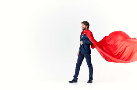 business man in a suit red raincoat work is a way of lifeの写真素材