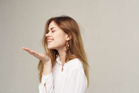 cheerful pretty woman hairstyle decoration posing studioの写真素材