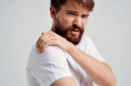 man holding neck arthritis health problems isolated backgroundの写真素材