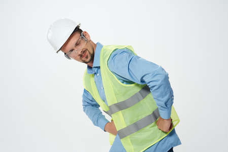 man in white helmet blueprints builder light background