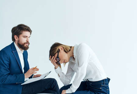 man and woman sitting on the couch communication work professionals teamの写真素材