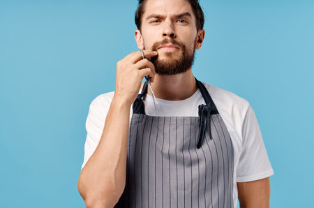 bearded man beauty saloon blue backgroundの写真素材