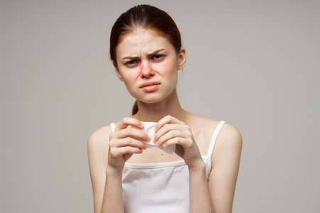 woman in white t-shirt with a scarf close-upの写真素材