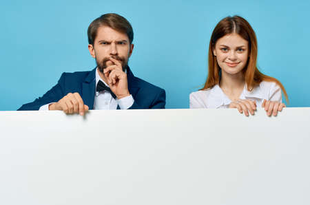 business man and woman advertising presentation white banner isolated backgroundの写真素材