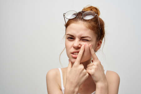 woman with a pimple on the face hygiene treatmentの写真素材