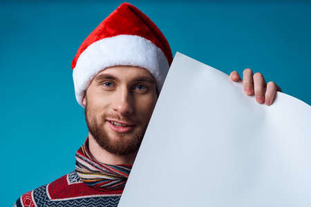 Cheerful man in a christmas white mockup Poster studio posingの写真素材